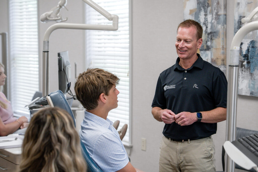 Orthodontic Evaluation for Kids at Balhoff Orthodontics in Lafayette Orthodontist examining a young patient at Balhoff Orthodontics in Lafayette, LA